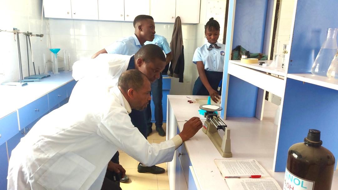 Teacher and students in the science laboratory
